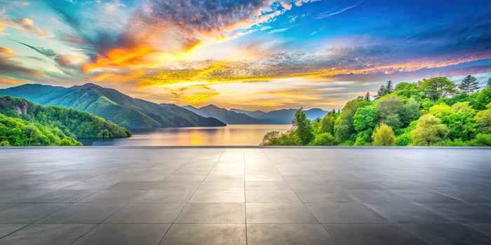 Stunning sunset view over a tranquil lake and lush hills. photo