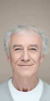 Senior man with gray hair smiling warmly at the camera, showcasing a friendly demeanor and positive attitude, representing the concept of aging gracefully and happiness concept photo