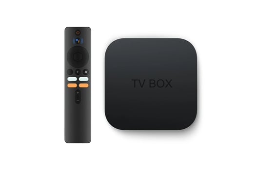 smart tv box with remote isolated on white background photo