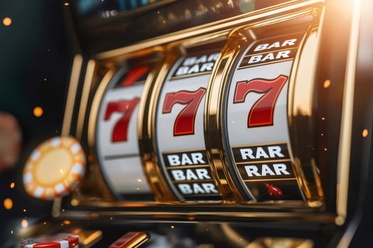Slot machine showing triple seven jackpot, casino gambling concept photo