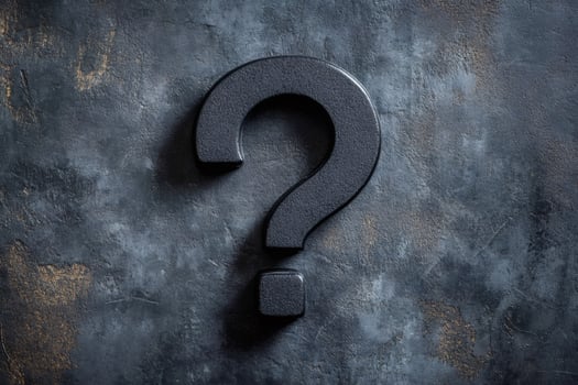 Mysterious black question mark on grunge background photo