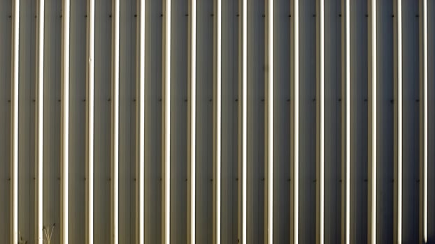 A close up of a wall with a metal roof photo