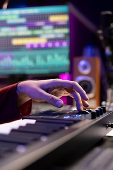 Audio engineer mixing and mastering music on daw software interface, creating cool modern tunes with acoustics and equalizer. Artist recording songs on soundboard panel in his home studio. photo
