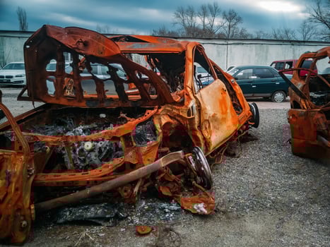 Completely burnt broken car after fire and wreck photo