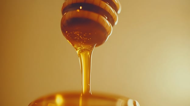 Honey Drips from a Dipper in a Delightful Flowing Motion photo