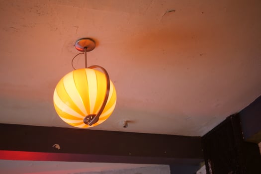 Unique hanging lamp in a cozy indoor setting photo