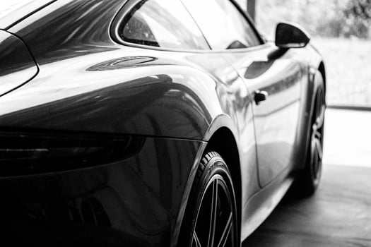 black and white photo of a sports car