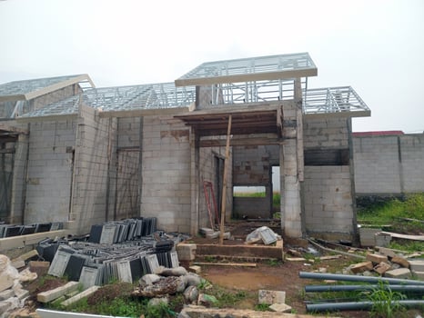 Unfinished House Structure with Exposed Roof Frame photo
