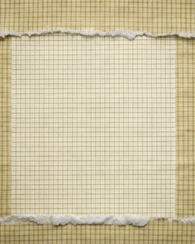 Torn grid paper with a vintage appearance. photo