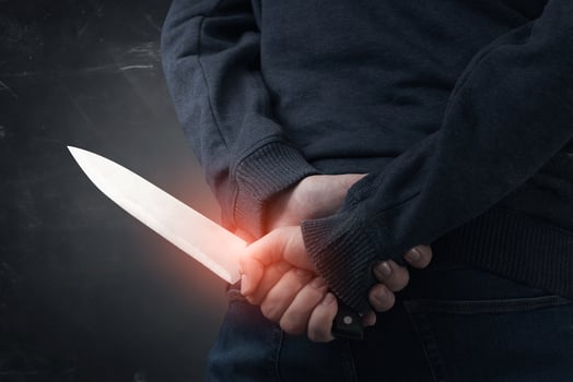 A person holding a knife in their hand photo