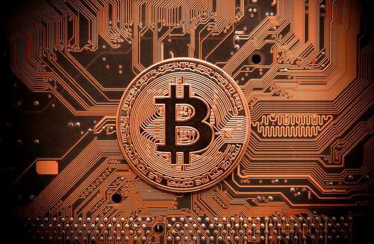 Bitcoin on circuit board photo