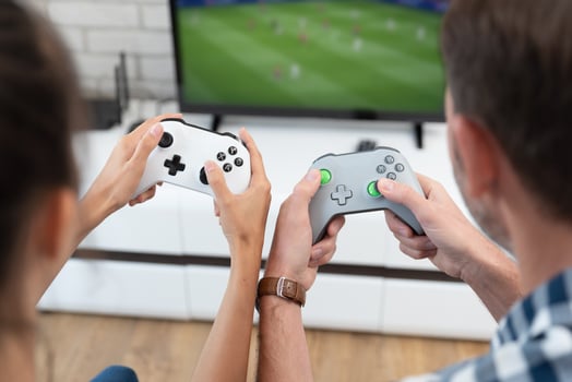 A man and woman playing games on a tv photo