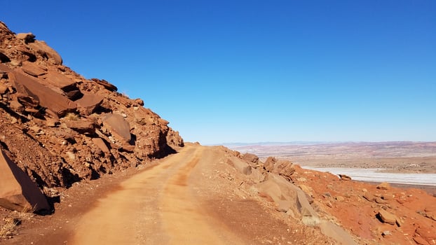 Off-road 4x4 Driving on Gemini Bridges Road Near Edge of a Cliff, Moab, Utah photo