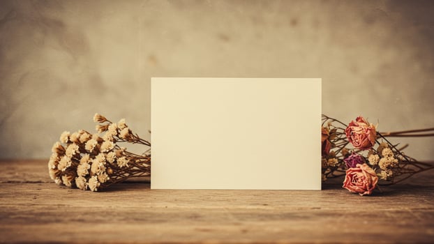 Blank note on wooden table with decorate dry flower set for copy space. great for elegant templates or journaling apps. photo