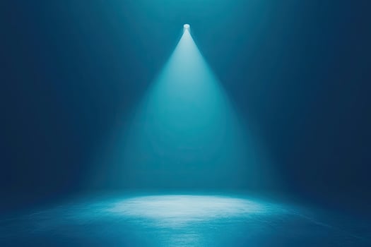 An empty room with a spotlight shining down on it photo
