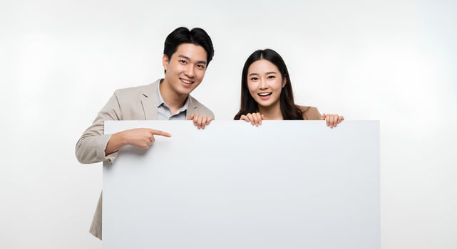 Happy Couple Holding Blank Sign, Ready for Announcement photo