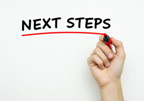 Next steps - hand writing the word next steps with marker on transparent screen photo