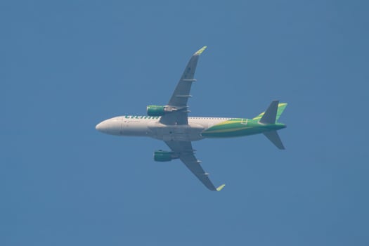 Malang, Indonesia, June 12, 2024. A Citilink plane Airbus A320 takes off from Abdulrachman Saleh Airport en route to Juanda Airport under clear weather and a blue sky. Blur photo