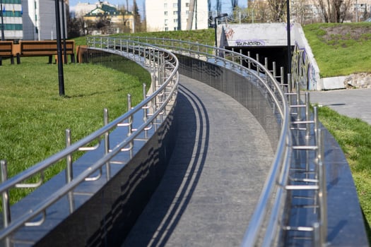 Long row of polished stainless steel railing photo