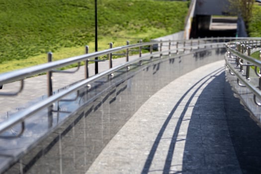 Long row of stainless steel railings, ramp for going up or down photo