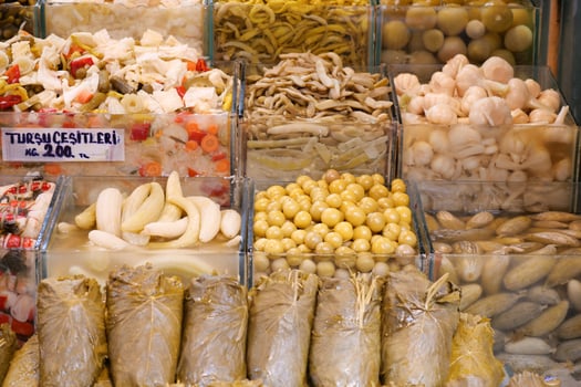 Colorful assortment of pickled vegetables at a market in Turkey photo