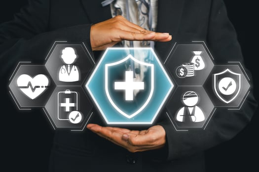 Conceptual image of health insurance with hands shielding medical and financial icons, symbolizing protection and security. photo