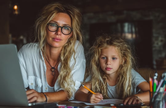 Mother and Daughter Doing Homework and Working Together photo