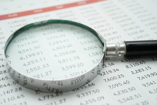 Magnifying glass on charts graphs paper. Financial development, Banking Account, Statistics, Investment Analytic r photo