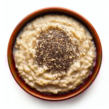 Top view of oatmeal with seeds in bowl photo