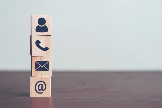 Contact us concept, Profiles and detailed personal information to identify yourself. Wooden blocks in his hand with icon telephone, mail and email, Online business communications concept, copy space photo