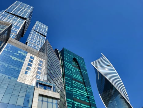 Moscow, Russia, 09 10 2024 Glass towers in the Moscow City business district rise against the blue sky. Modern architecture, background. photo