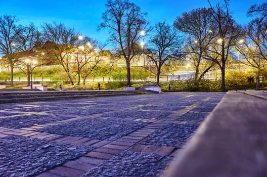 Park with a bench and a walkway photo