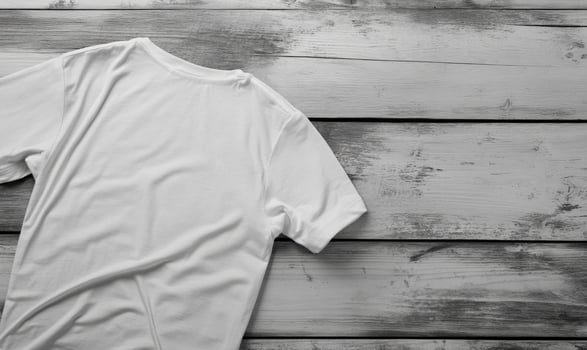 white t - shirt on wooden background photo