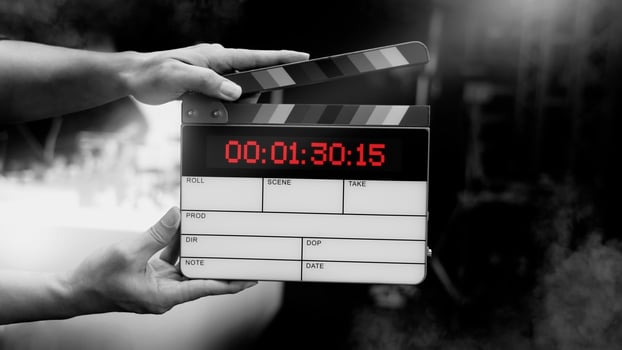 Hand hitting timecode, clapperboard or movie slate for Production. photo