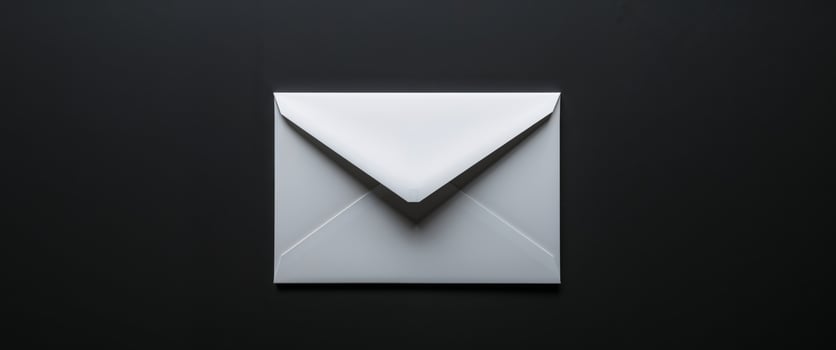 Blank White Envelope on Black Background Mockup. photo