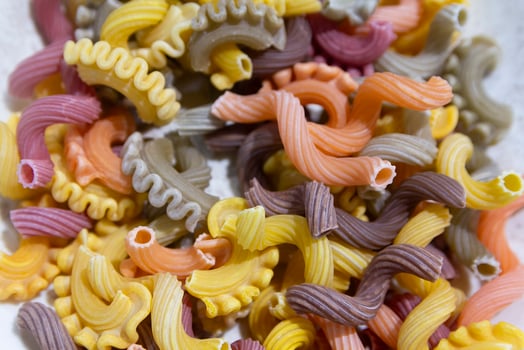 Colorful pasta of various shapes close-up photo