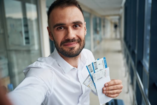Making, selfie, happy facial expression. Young handsome man in the airport photo