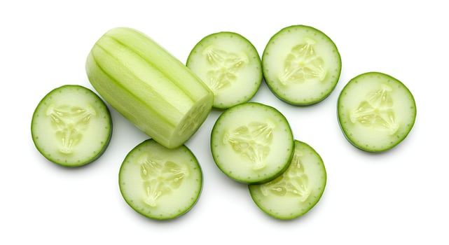Whole fresh cucumber isolated on white background for healthy eating and vegan food concepts photo