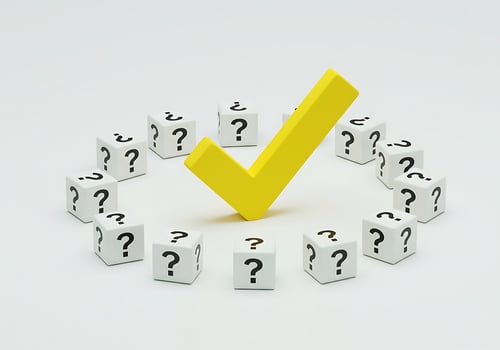 A yellow check mark surrounded by white dices photo