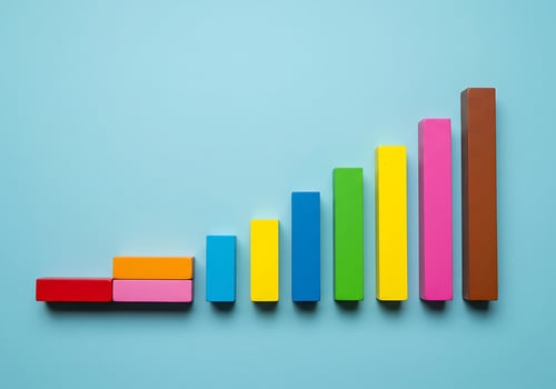 Colorful wooden blocks on a blue background photo