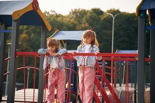 In casual clothes. Kids are having fun, on ,the playground photo