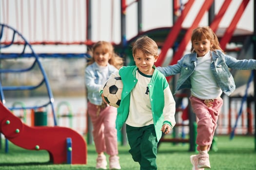 On the playground... Kids are having fun together photo