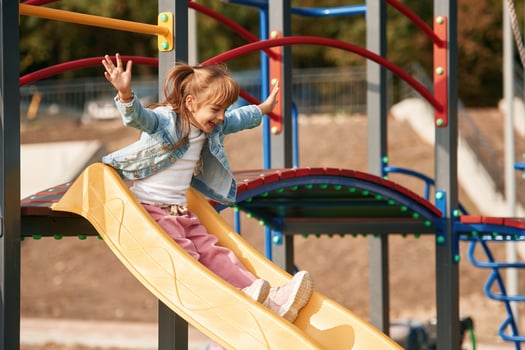 Little ,girl is having fun on the playground photo