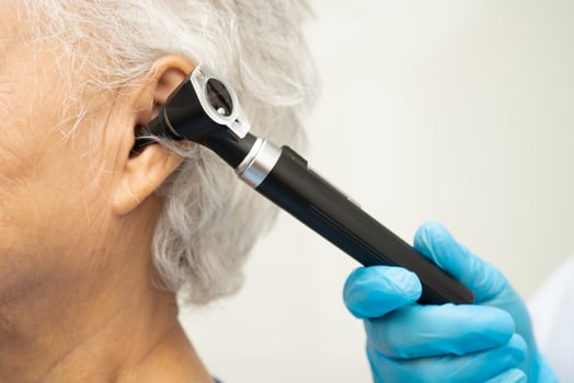 Otolaryngologist or ENT physician doctor examining photo