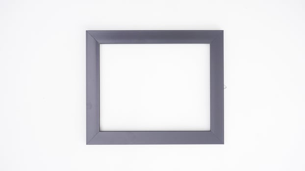 Black colored wood picture frame isolated on white background photo