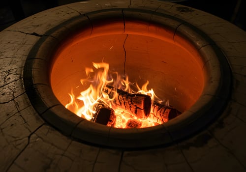 Burning Firewood in Outdoor Clay Oven Offering Warmth and Rustic Charm photo