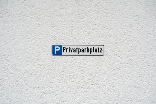 Private Parking Sign on Textured Wall Background photo
