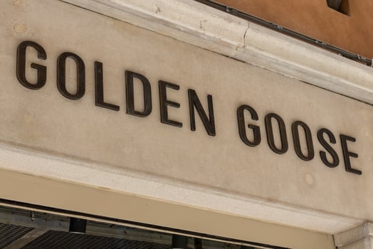 Venice, Italy - April 20 2025 Golden Goose brand logo on boutique facade in Venice city center photo