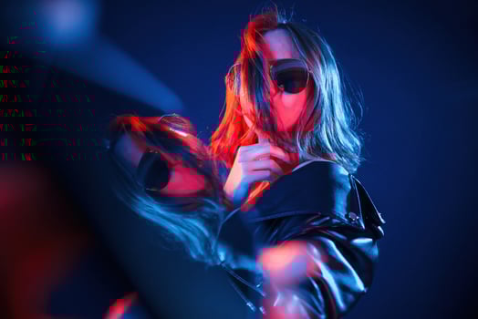 Reflection, on the left,,, side. Cool young woman portrait in neon colors photo