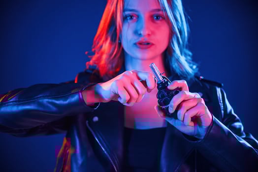Holding grenade.,, Cool young woman portrait in neon colors photo
